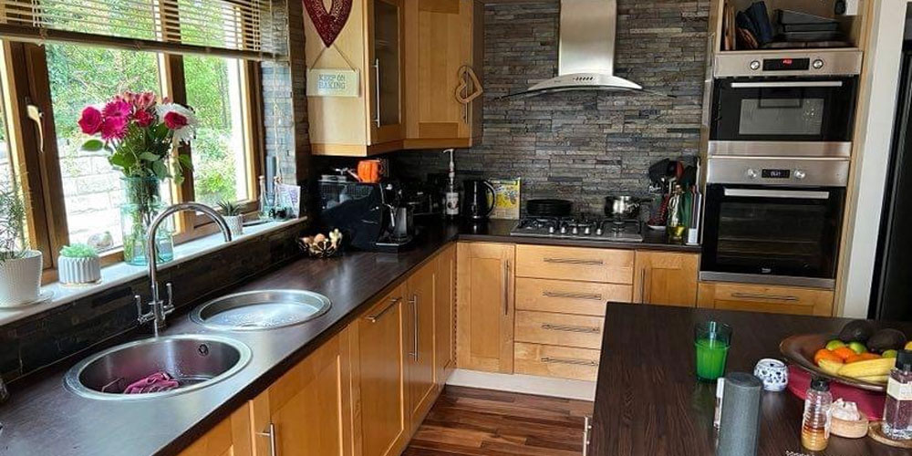 Before shot of kitchen with wooden cabinets