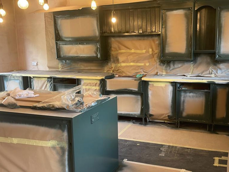 Kitchen in Chester taped up ready for spray paint